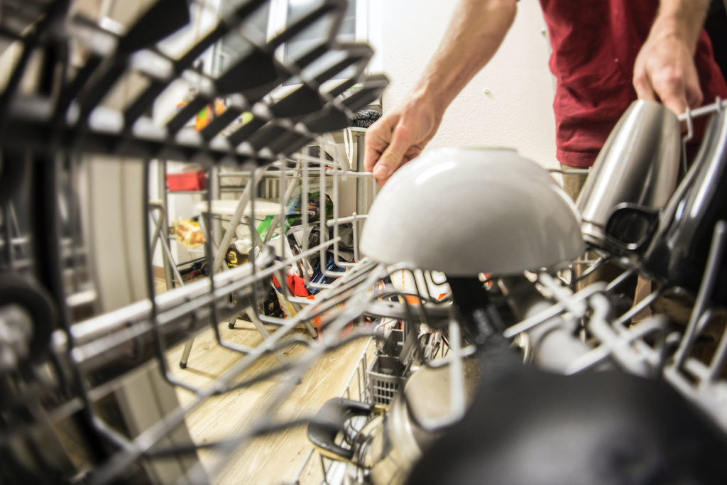 Staff loading dishwasher